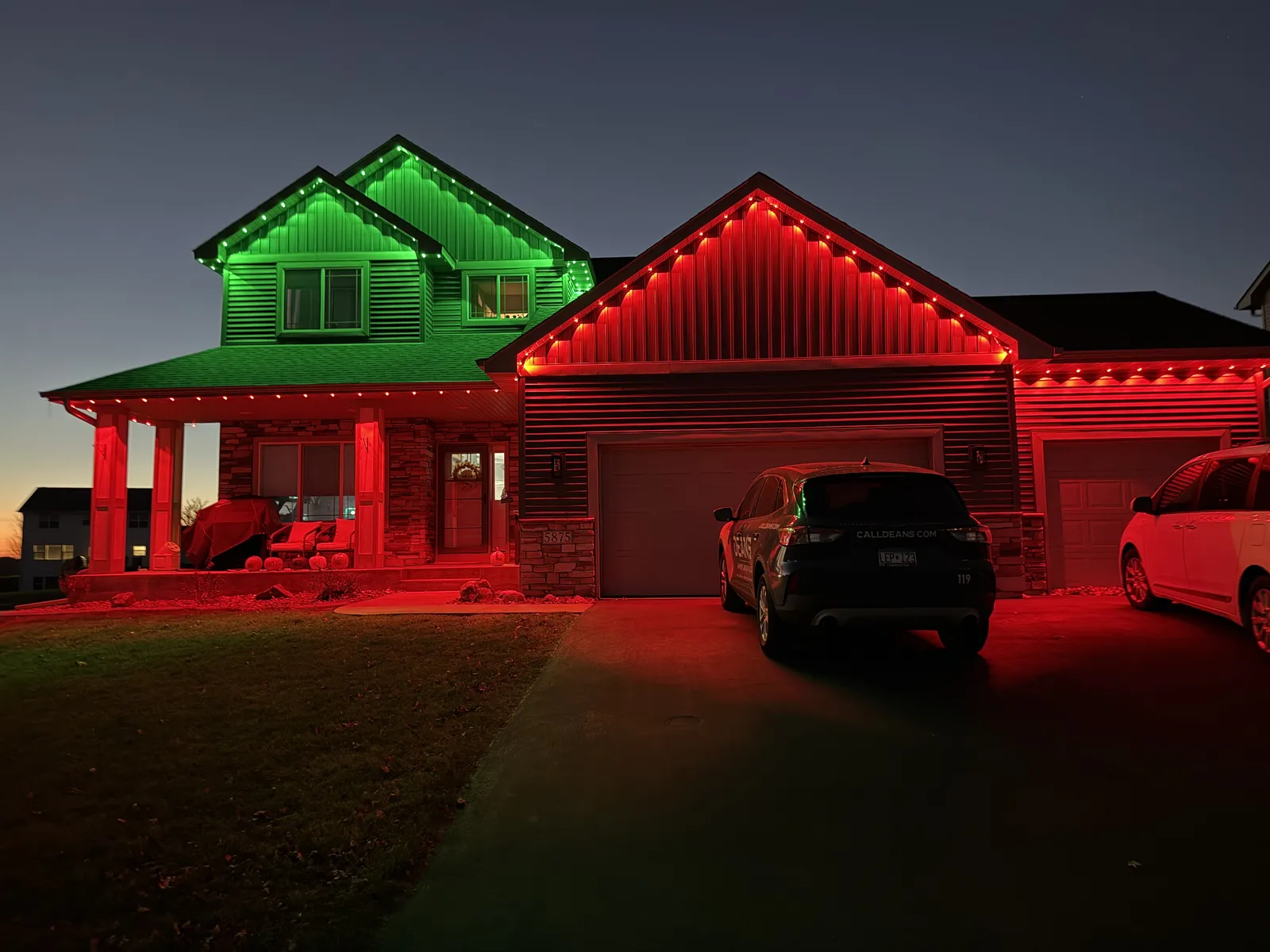Home lit in red and green permanent Christmas lighting