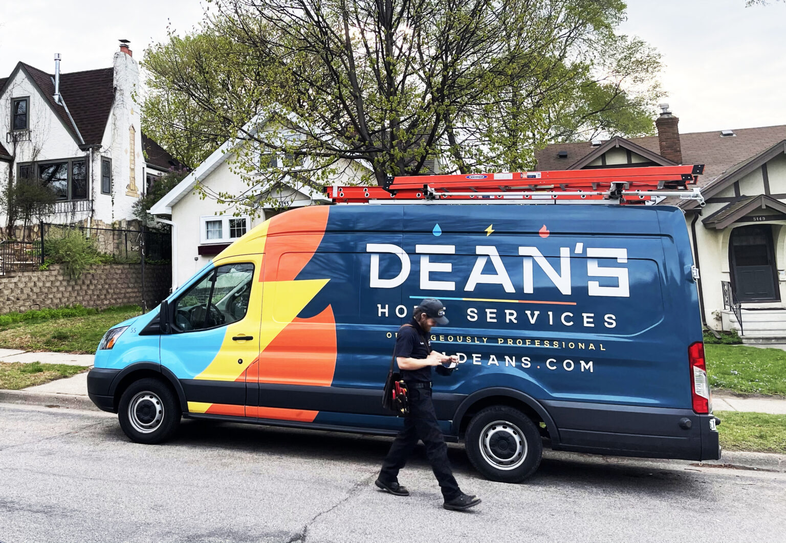 Dean's service van parked in front of a residence