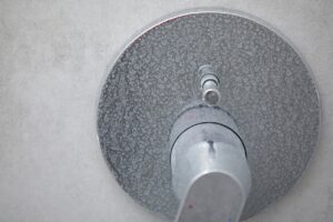Limescale and soap scum on shower from hard water