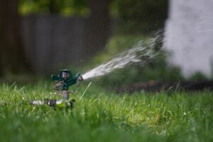 Water sprinkler system spraying a yard