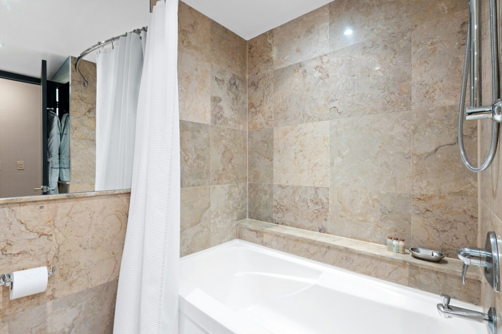 Bathtub with shower head in a bathroom